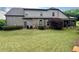 Backyard featuring a spacious lawn and covered patio area perfect for entertaining at 5403 Timber Wild Ln, Buford, GA 30518