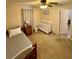 An inviting bedroom with crib, twin bed, and ceiling fan at 5403 Timber Wild Ln, Buford, GA 30518