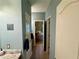 Hallway with tile floor leading to bedrooms and bathroom at 5403 Timber Wild Ln, Buford, GA 30518