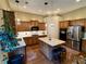 Modern kitchen with stainless steel appliances, granite countertops, and a center island with seating at 5403 Timber Wild Ln, Buford, GA 30518