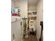 A bright laundry room features a utility sink, washer, and shelving at 5403 Timber Wild Ln, Buford, GA 30518