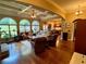 Inviting living room filled with natural light, coffered ceilings, and access to the kitchen at 5403 Timber Wild Ln, Buford, GA 30518