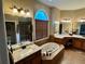 Luxurious main bathroom with a soaking tub, separate shower, and dual vanities at 5403 Timber Wild Ln, Buford, GA 30518