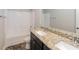 Bathroom featuring double sinks with granite counters and a shower/tub combo at 89 Citadel Dr, Hampton, GA 30228