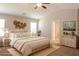 Relaxing main bedroom with neutral tones, a ceiling fan, and an ensuite bathroom at 89 Citadel Dr, Hampton, GA 30228