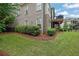 Expansive backyard featuring lush green lawn and landscaped garden beds at 125 Windy Pines Pass, Roswell, GA 30075