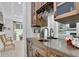 Wet bar features wine storage and view to living area at 125 Windy Pines Pass, Roswell, GA 30075