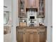 Wet bar features wine storage and view to living area at 125 Windy Pines Pass, Roswell, GA 30075