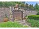 Outdoor common area with arbor, bench seat, and potted plants at 125 Windy Pines Pass, Roswell, GA 30075