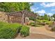 Common area featuring a pergola with wooden benches and stone wall at 125 Windy Pines Pass, Roswell, GA 30075