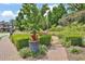 Community park with benches surrounded by manicured greenery and walking paths at 125 Windy Pines Pass, Roswell, GA 30075