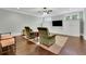 Open living space featuring hardwood floors and built-in cabinetry at 125 Windy Pines Pass, Roswell, GA 30075