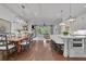 Open concept living and dining room, open to the kitchen, with lots of natural light at 125 Windy Pines Pass, Roswell, GA 30075