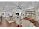 Expansive living room with beamed ceilings, shiplap walls, and hardwood floors at 125 Windy Pines Pass, Roswell, GA 30075