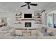 Cozy living room with fireplace, built-in shelves, and comfortable seating area at 125 Windy Pines Pass, Roswell, GA 30075