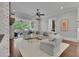 Bright living room featuring a cozy sitting area, fireplace, and an open door to the outside deck at 125 Windy Pines Pass, Roswell, GA 30075