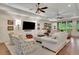 Spacious living room with shiplap walls, recessed lighting, ceiling fans, and ample seating at 125 Windy Pines Pass, Roswell, GA 30075