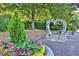 Heart-shaped sculpture near the Roswell Town Hall with colorful flowers around at 125 Windy Pines Pass, Roswell, GA 30075
