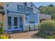 VAS Kouzina True Greek Cooking exterior view with light blue painted doors and shutters at 125 Windy Pines Pass, Roswell, GA 30075
