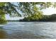 A beautiful river flowing through trees at 125 Windy Pines Pass, Roswell, GA 30075