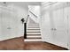 Staircase featuring hardwood floors and a neutral color palette at 125 Windy Pines Pass, Roswell, GA 30075