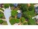 A bird's eye view of the home nestled on a tranquil lot surrounded by mature trees and landscaping at 1720 Greystone Trce, Conyers, GA 30013