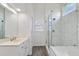 Bathroom featuring a marble walk-in shower and double vanity at 1720 Greystone Trce, Conyers, GA 30013
