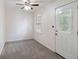 Bedroom featuring a ceiling fan, carpet flooring, and a door to the outside at 1720 Greystone Trce, Conyers, GA 30013