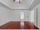 Spacious bedroom with hardwood floors, tray ceiling, and ample closet space at 1720 Greystone Trce, Conyers, GA 30013