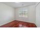 Bedroom with hardwood floors, a closet, and a window bringing in natural light at 1720 Greystone Trce, Conyers, GA 30013