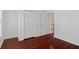 Bedroom with beautiful hardwood floors and multiple closets for ample storage at 1720 Greystone Trce, Conyers, GA 30013