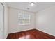 Neutral bedroom featuring hardwood floors, white walls, and a large window at 1720 Greystone Trce, Conyers, GA 30013