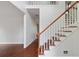 Bright foyer with hardwood floors, a staircase, and a view into other rooms at 1720 Greystone Trce, Conyers, GA 30013