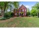 Charming two-story brick home with manicured landscaping and a well-maintained lawn at 1720 Greystone Trce, Conyers, GA 30013