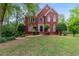 Charming two-story brick home with manicured landscaping and a well-maintained lawn at 1720 Greystone Trce, Conyers, GA 30013