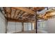Spacious two-car garage with exposed insulation, white doors, and room for storage or a workshop at 1720 Greystone Trce, Conyers, GA 30013