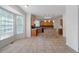 Wide view of kitchen and breakfast area with light tile floor, wood cabinets, and lots of light at 1720 Greystone Trce, Conyers, GA 30013