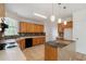 Bright kitchen with wooden cabinets, tiled backsplash, and lots of counter space at 1720 Greystone Trce, Conyers, GA 30013