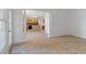 Open-concept space with tile floors and access to the kitchen area at 1720 Greystone Trce, Conyers, GA 30013