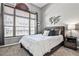 Comfortable bedroom featuring a large window and modern decor at 955 Juniper Ne St # 2322, Atlanta, GA 30309
