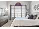 Comfortable bedroom with a large window, dresser, and modern decor at 955 Juniper Ne St # 2322, Atlanta, GA 30309
