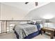 Cozy bedroom loft featuring a wrought iron railing and carpet flooring at 955 Juniper Ne St # 2322, Atlanta, GA 30309