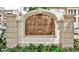 Close-up of the Tuscany Condominiums sign with floral landscaping below at 955 Juniper Ne St # 2322, Atlanta, GA 30309