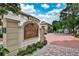 Entrance to Tuscany Condominiums features bricked drive and elegant sign at 955 Juniper Ne St # 2322, Atlanta, GA 30309