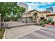 Exterior view of a Tuscan-style apartment complex with a gated entrance and lush landscaping in an urban setting at 955 Juniper Ne St # 2322, Atlanta, GA 30309