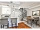 Kitchen and dining area featuring granite countertops and a spiral staircase at 955 Juniper Ne St # 2322, Atlanta, GA 30309