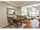 Open-concept space with hardwood floors, dining table, and a spacious living room with large window at 955 Juniper Ne St # 2322, Atlanta, GA 30309