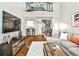 Spacious living room featuring a view of the spiral staircase and kitchen at 955 Juniper Ne St # 2322, Atlanta, GA 30309