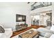 Open-concept living space with kitchen, spiral staircase, and hardwood floors at 955 Juniper Ne St # 2322, Atlanta, GA 30309
