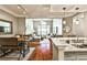 Spacious and open living space with kitchen bar, living room, and dining area with hardwood floors at 955 Juniper Ne St # 2322, Atlanta, GA 30309